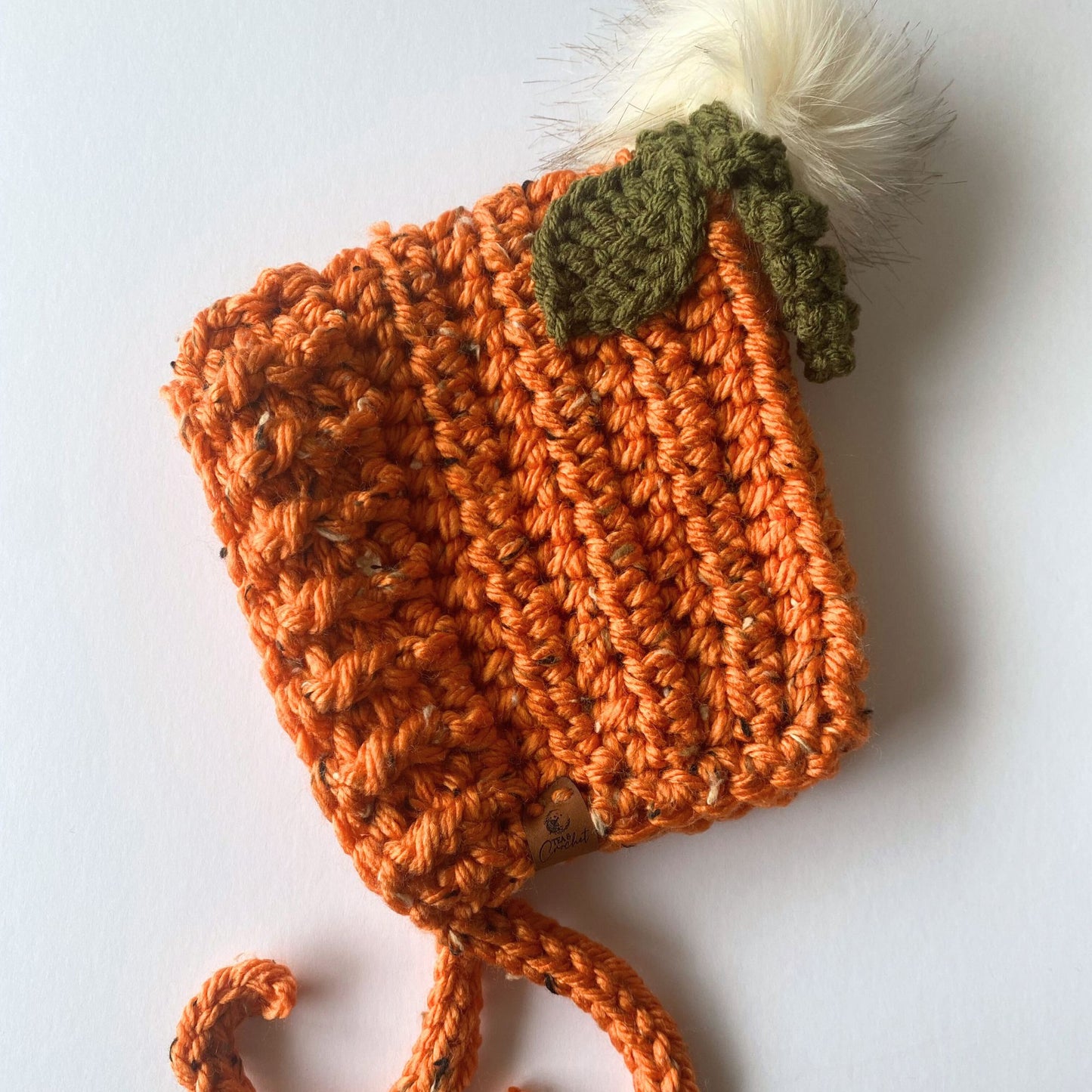 Pumpkin Pixie bonnet with pompom, twizzle and leaf