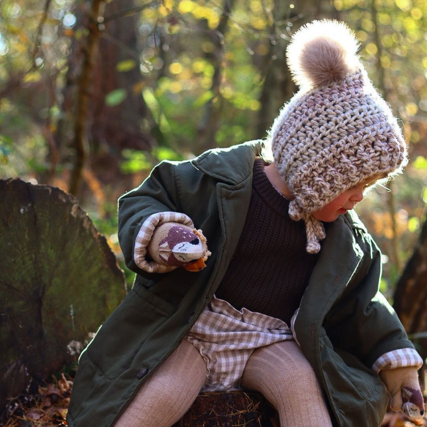 Fitted pixie bonnet with faux fur pompom