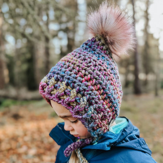 Fitted pixie bonnet with faux fur pompom